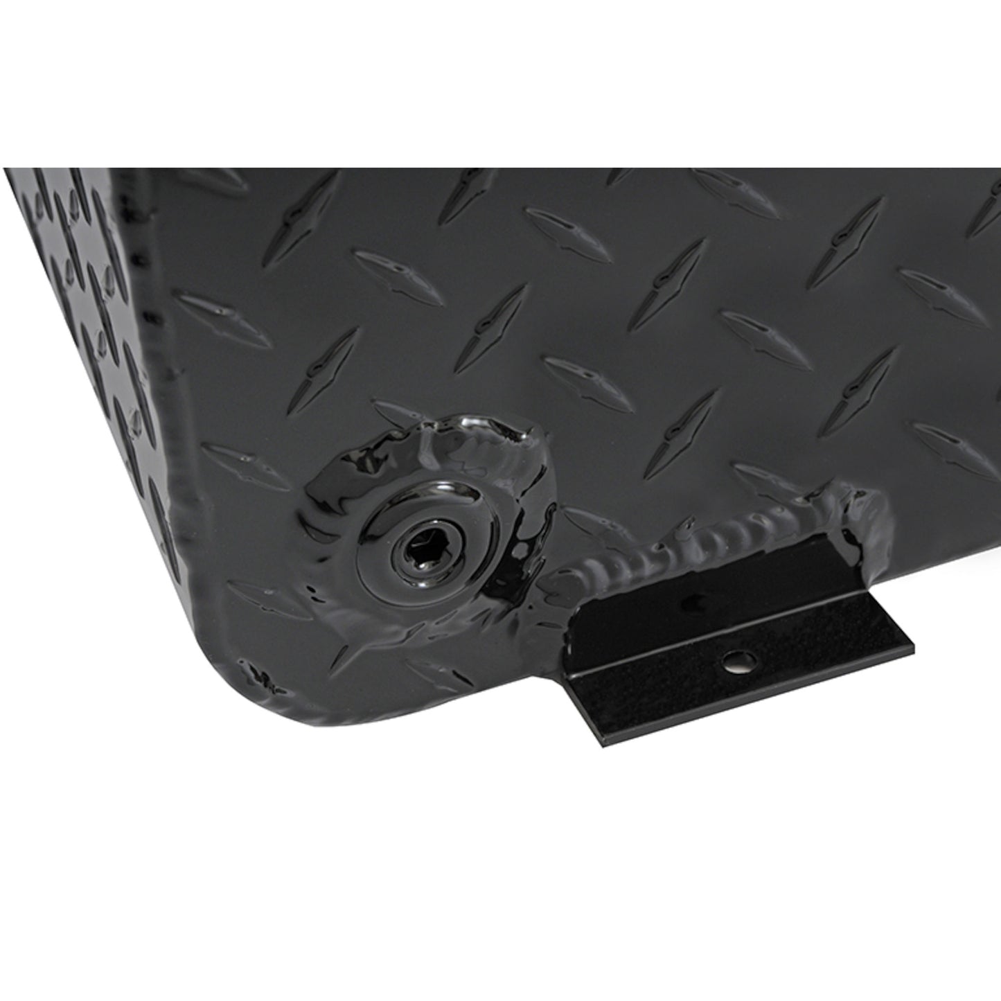 Close-up view of the corner on the Dee Zee Long Rectangle Transfer Tank BlackTread DZ92556NB, highlighting the diamond plate texture, radius curve design, lockable filler neck, and mounting tab on this durable non-rusting Brite-Tread aluminum transfer tank with gloss black powder coat finish.