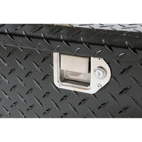 Close-up of stainless steel locking paddle handle on the DeeZee 111 gallon aluminum transfer tank toolbox combo (DZ92656B), providing secure tool storage and easy access.
