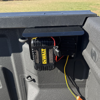 PowerMate Converter (SKU PMC1001) with DeWalt battery installed inside vehicle cab