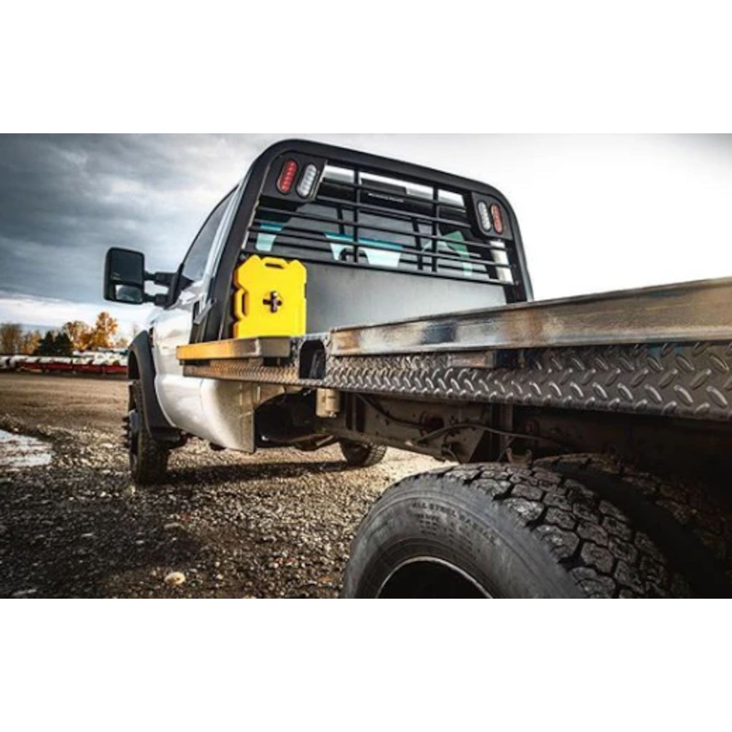Yellow RotoPax 2 gallon diesel fuel container securely mounted on a truck bed using a RotoPax mounting system