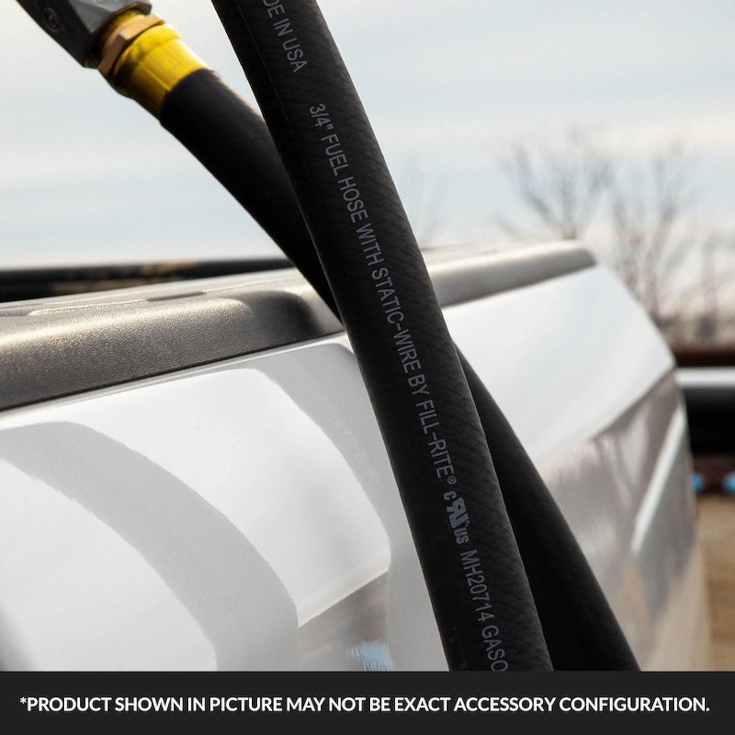 3/4" x 12' fuel transfer hose connected to manual nozzle during fueling; features static wire for safety; note: product shown may vary in exact accessory configuration