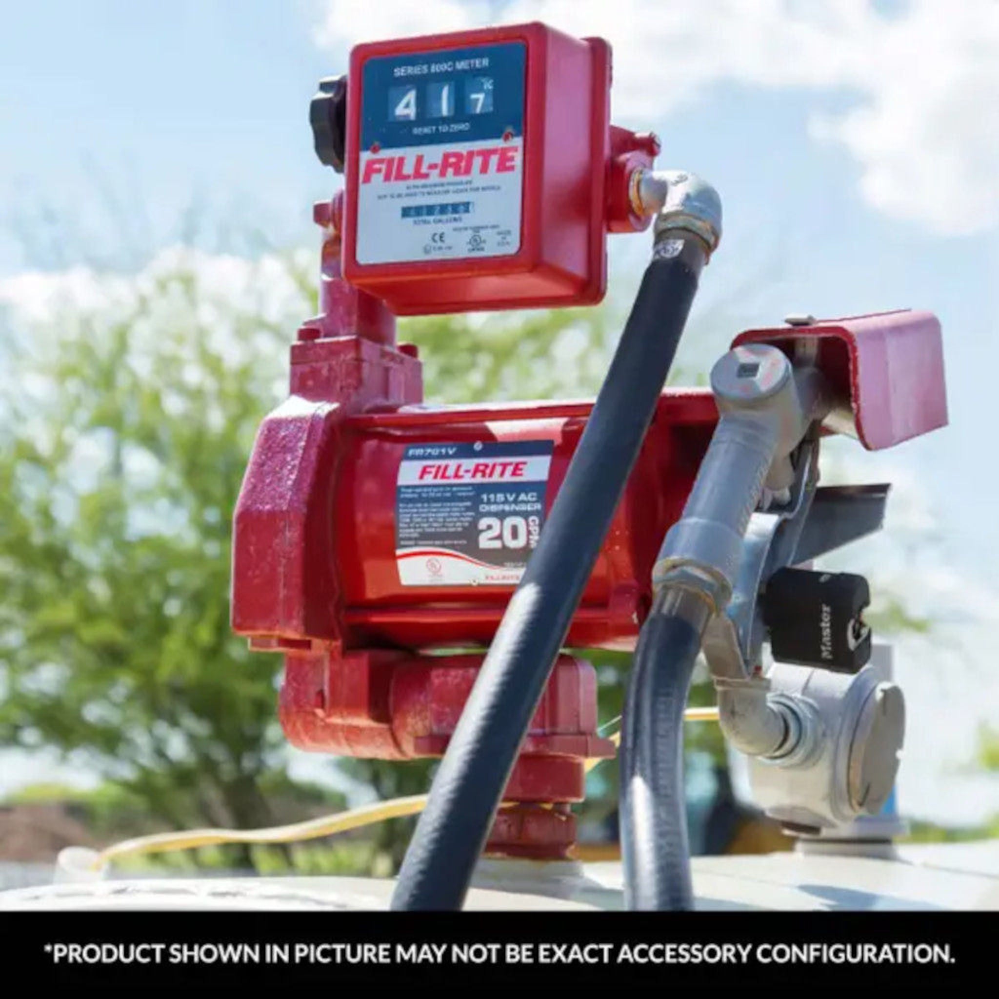 Close-up view of Fill-Rite 807CMK 3-digit mechanical fuel transfer meter in gallons during use on a fuel pump setup outdoors; note: product shown may vary in exact accessory configuration