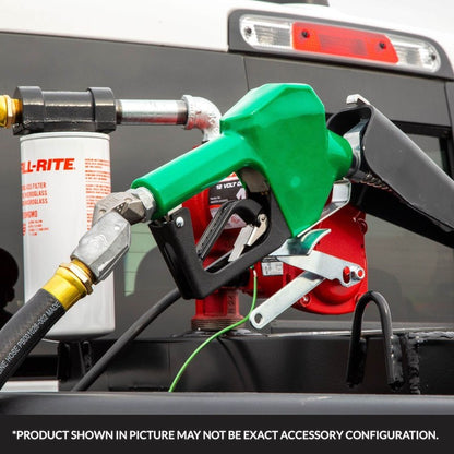 Fill-Rite SDN075GAN 3/4" green automatic diesel nozzle mounted on fuel transfer pump with filter and hose in outdoor application; note: product shown may vary in exact accessory configuration