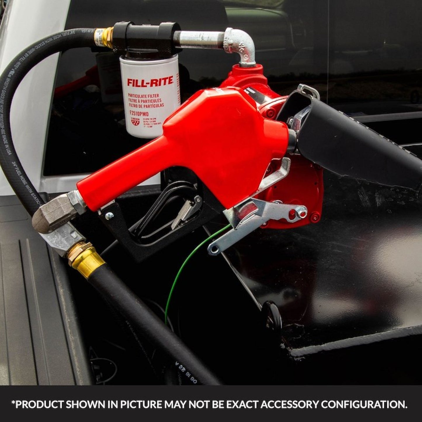 Fill-Rite SDN075RAN 3/4" red automatic gasoline nozzle mounted on fuel transfer pump with filter and hose in outdoor application; note: product shown may vary in exact accessory configuration