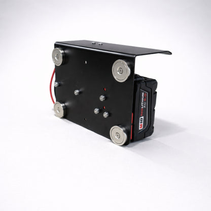 Milwaukee 12V battery converter with magnetic mounting bracket showing four heavy duty magnets for secure mounting