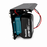 Side view of PowerMate Makita 18V LXT to 12V converter mounted on magnetic steel bracket with battery installed