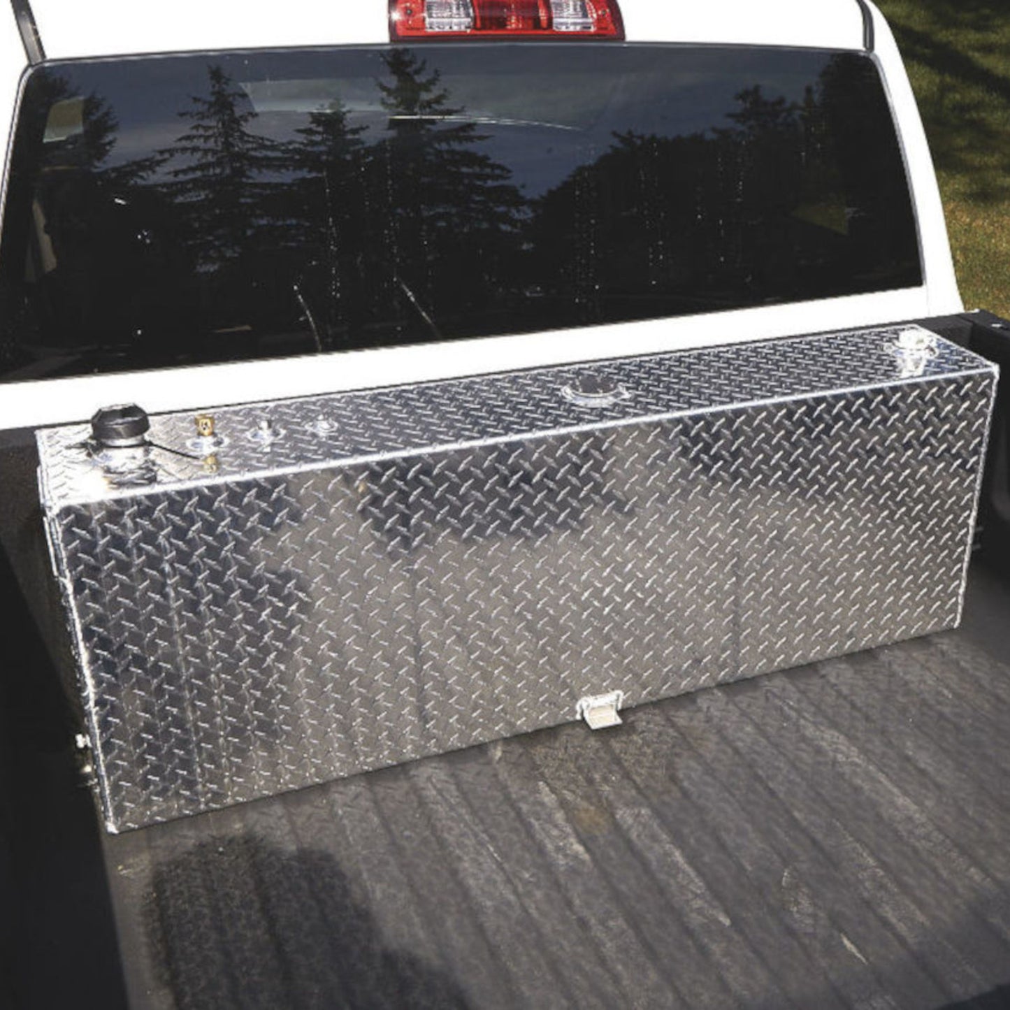 RDS 45-gallon aluminum transfer fuel tank installed in white pickup truck bed: compact auxiliary storage for diesel or non-potable liquids on the go.