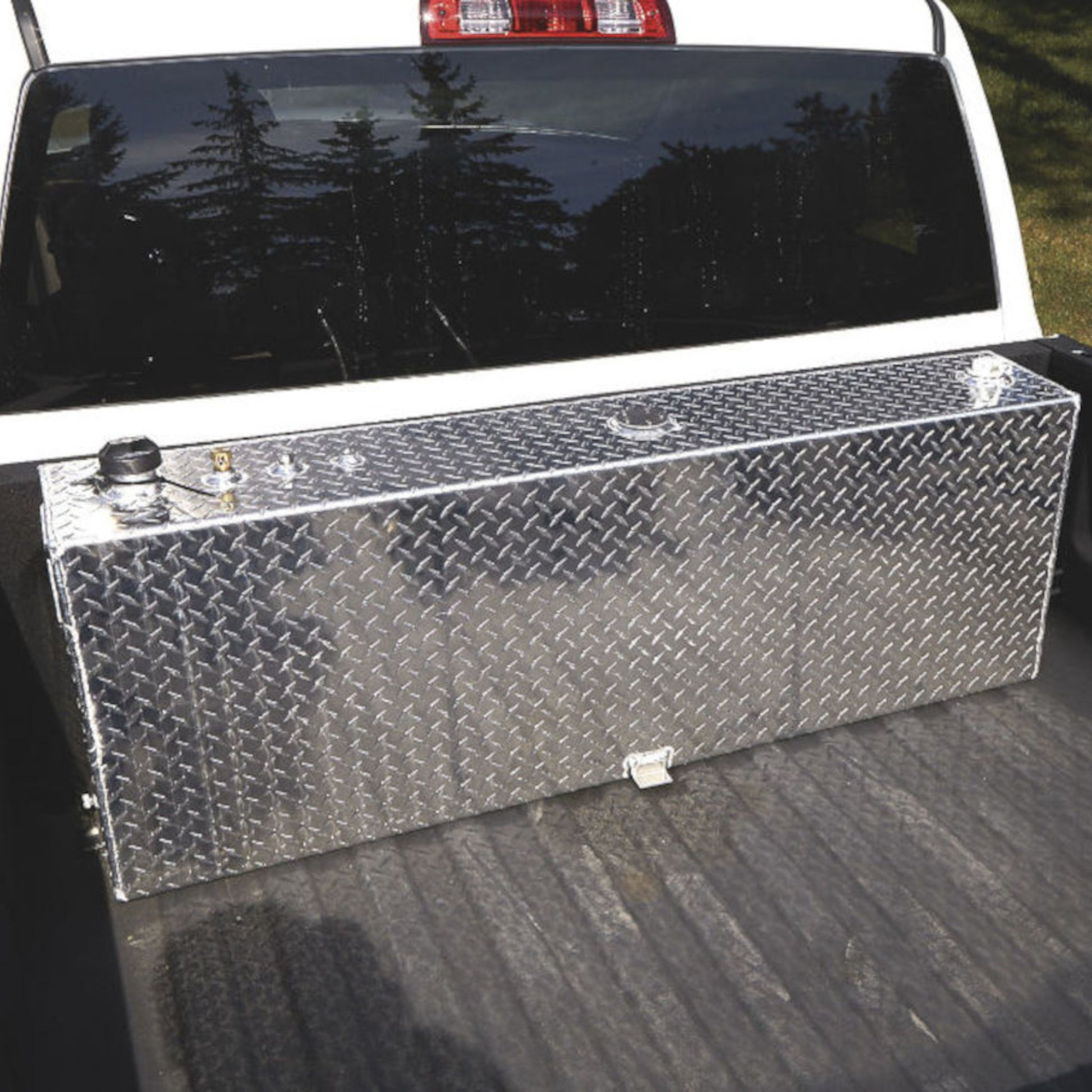 RDS 45-gallon aluminum transfer fuel tank installed in white pickup truck bed: compact auxiliary storage for diesel or non-potable liquids on the go.
