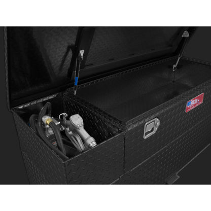 Close-up pump installation in RDS 60-gallon black transfer tank/toolbox: 12V electric pump, hose, nozzle, and secure mounting for reliable fueling.