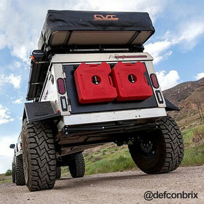 RotoPax RX-PM pack mount retaining fuel containers during off-road driving