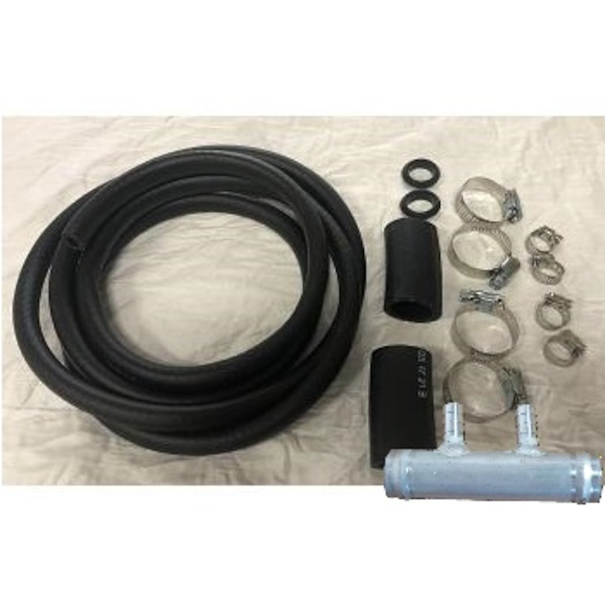 Universal auxiliary gasoline install kit: includes 3/8" black rubber fuel hose, aluminum double-port tee adapter, rubber couplings, and clamps for truck tank connection.